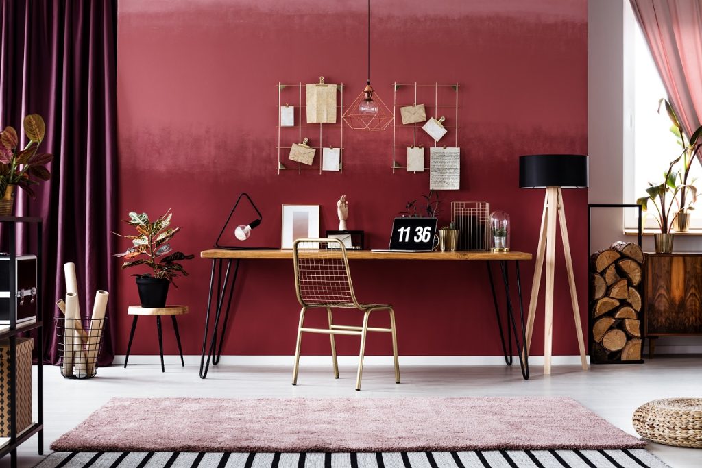 Home office decor with red accent wall