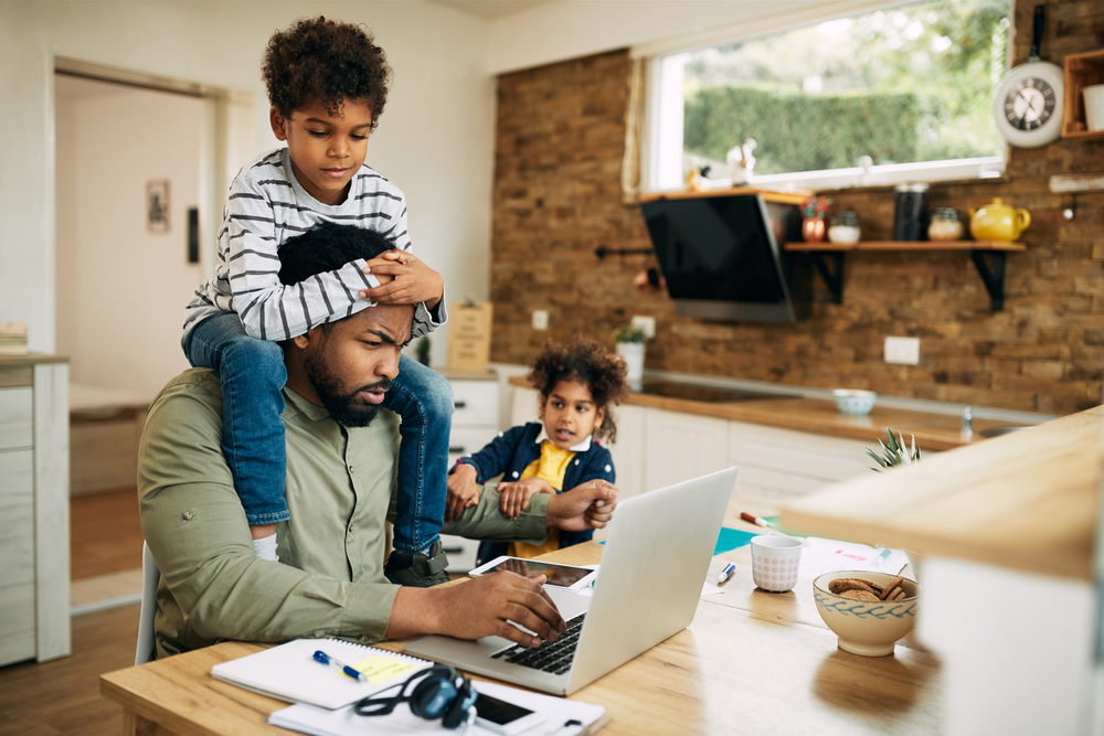 Father who needs time management skills as he works from home with his children.