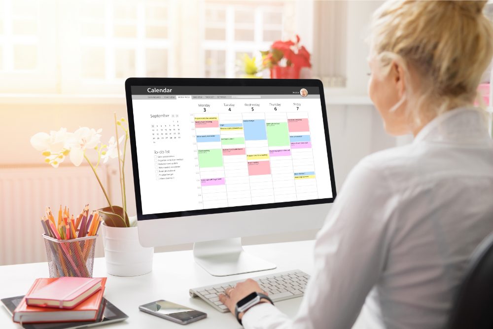 Woman creating a work schedule that blocks time for deep work.