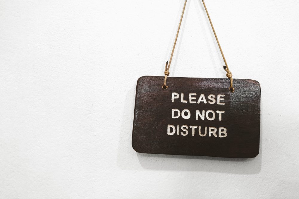 Use a physical or virtual do not disturb sign to avoid being interrupted during deep work sessions.